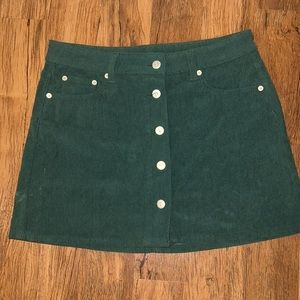 Corduroy emerald green skirt. Closure buttons down the middle. Worn once. TTS.